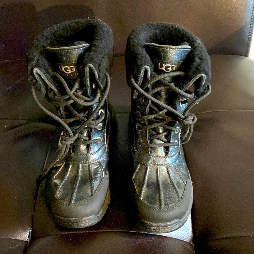 UGG brand girls snow boots. Worn once before our daughter forgot about them.